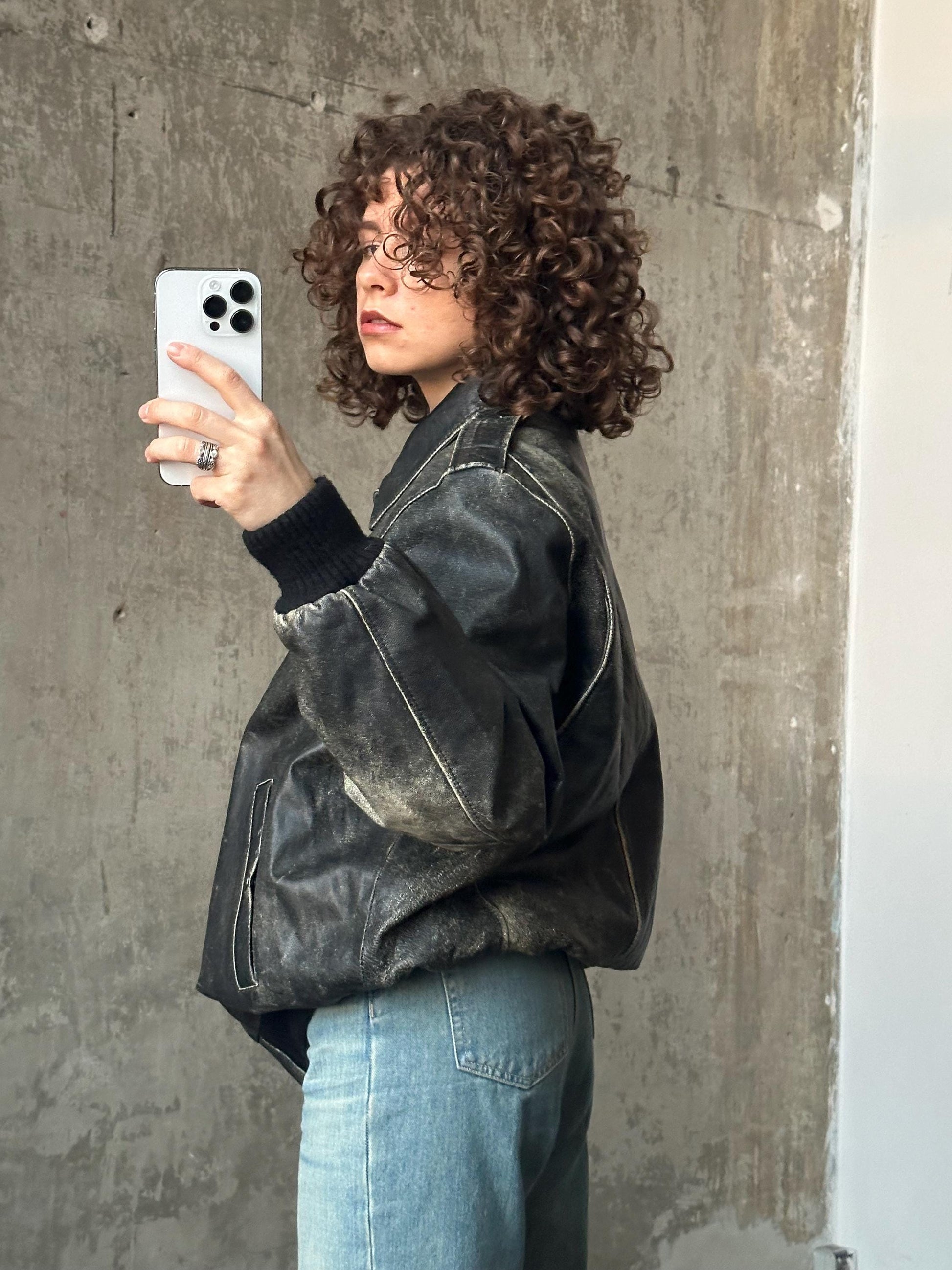 Vintage distressed leather bomber jacket in black with shades