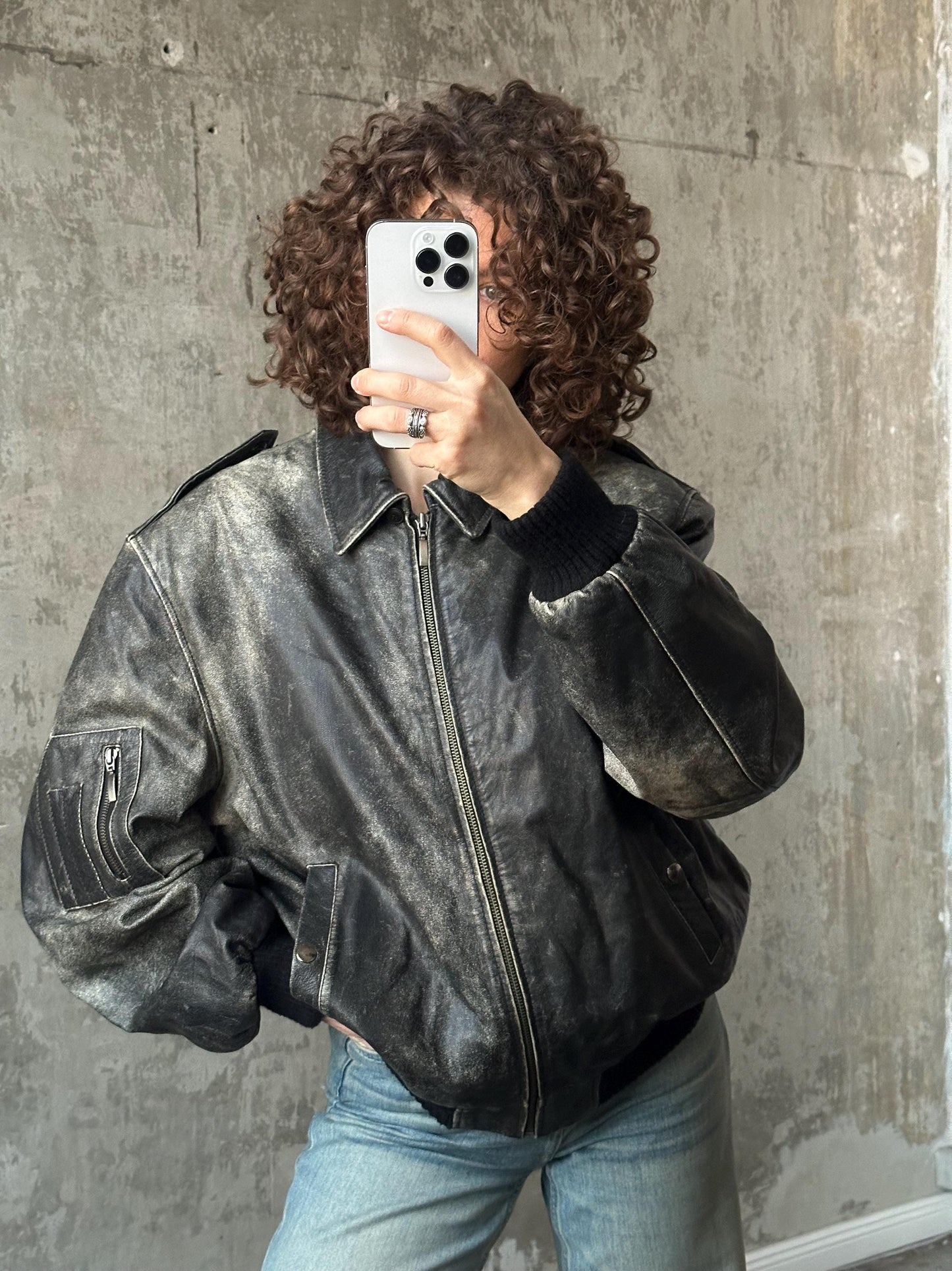 Vintage distressed leather bomber jacket in black with shades