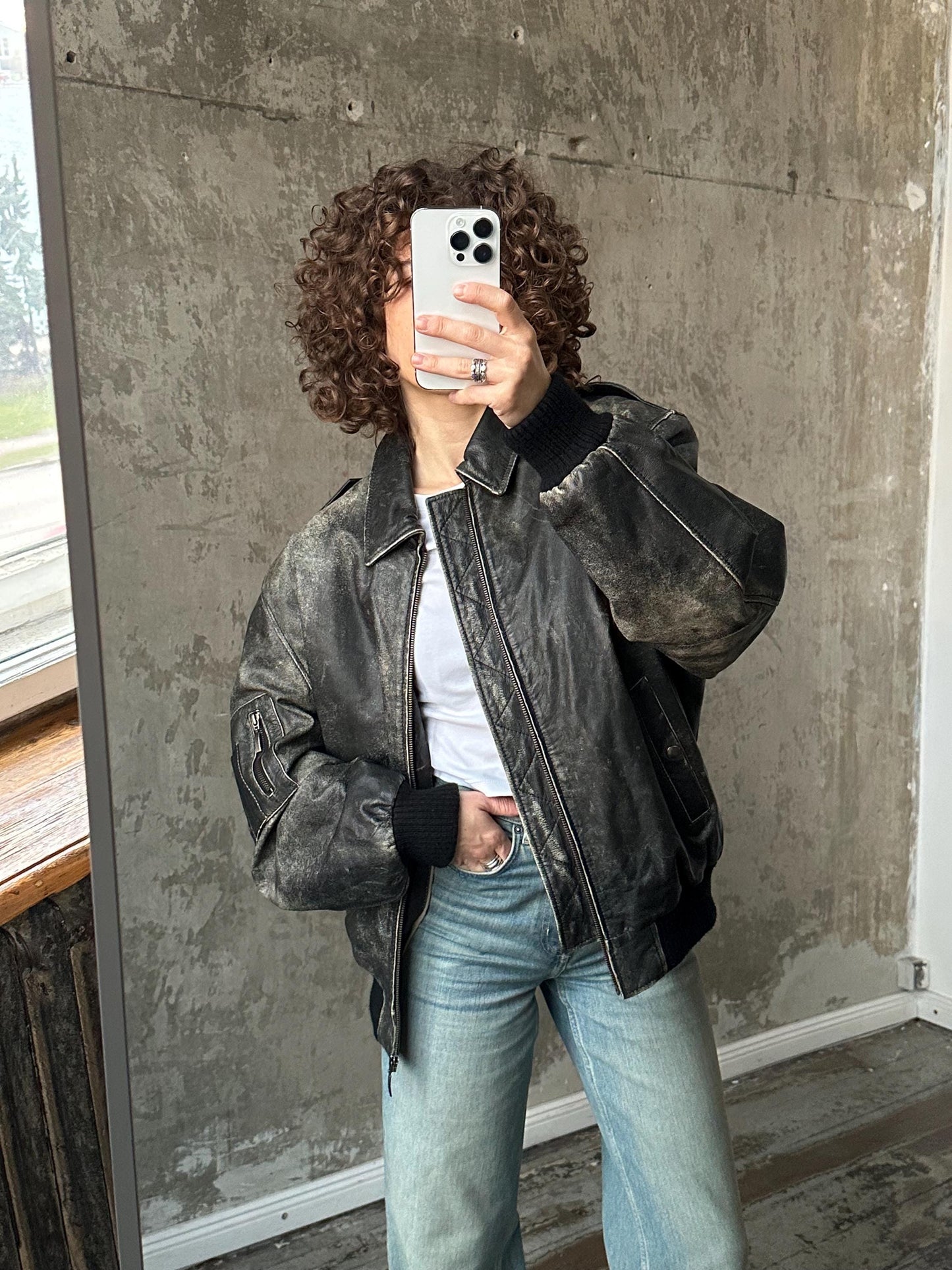 Vintage distressed leather bomber jacket in black with shades