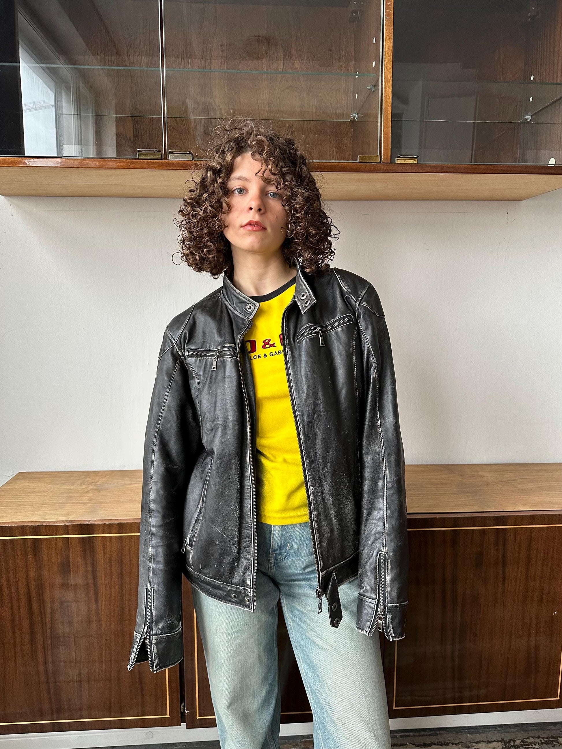 Vintage distressed leather bomber jacket in black with shades